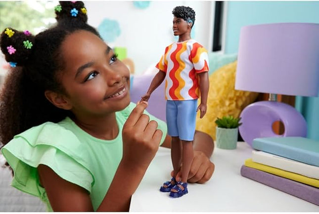 Barbie Fashionistas Ken Doll #220 with Behind-The-Ear Hearing Aids & Broad Body Wearing a Removable Orange Patterned Shirt, Shorts & Jelly Sandals