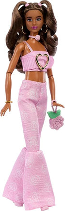 Barbie Deluxe Style Doll #12 in Pink Denim Crop Top with Matching Rose Print Flare Jeans, Wavy Brown Hair, Accessories Like Rose Handbag and Jewelry