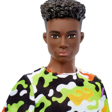 Barbie Fashionistas Ken Doll #123, Broad with Black Curly Hair Wearing Multi-Colored Camo Print Shirt, Neon Green Shorts & Silvery Sneakers