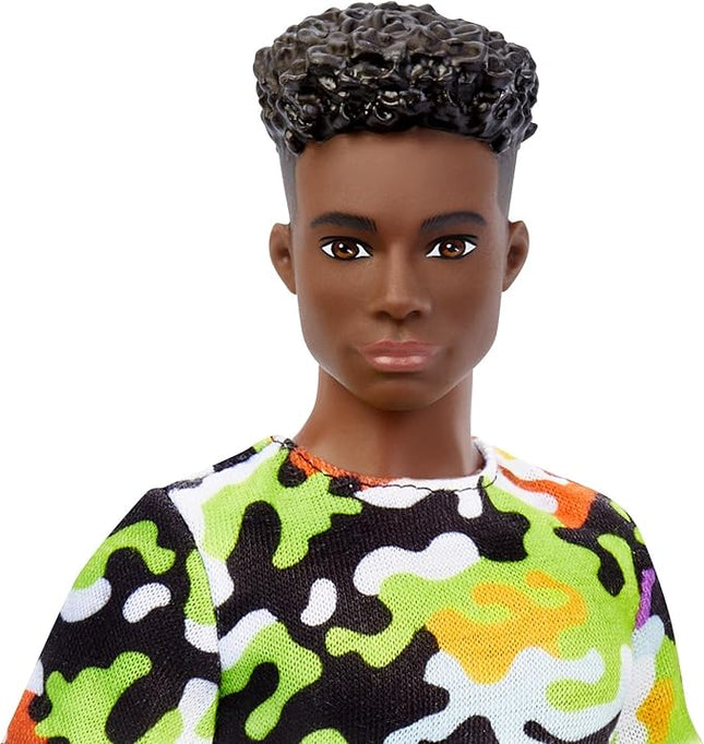Barbie Fashionistas Ken Doll #123, Broad with Black Curly Hair Wearing Multi-Colored Camo Print Shirt, Neon Green Shorts & Silvery Sneakers