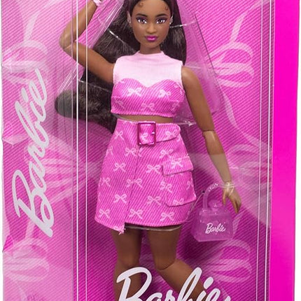 Barbie Deluxe Style Doll #10 in Pink Denim Top and Skirt Set with Bow Print, Black Hair, Behind-The-Ear Hearing Aids and Accessories Like Handbag