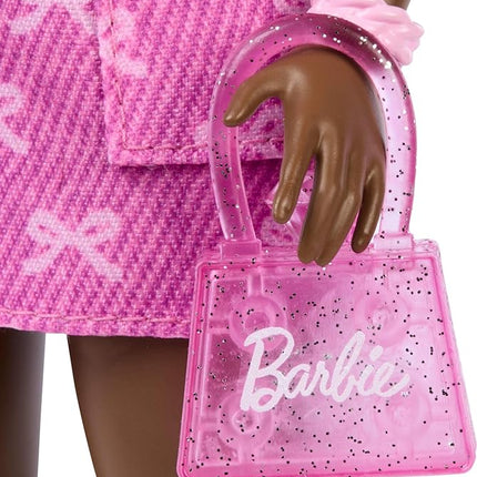 Barbie Deluxe Style Doll #10 in Pink Denim Top and Skirt Set with Bow Print, Black Hair, Behind-The-Ear Hearing Aids and Accessories Like Handbag