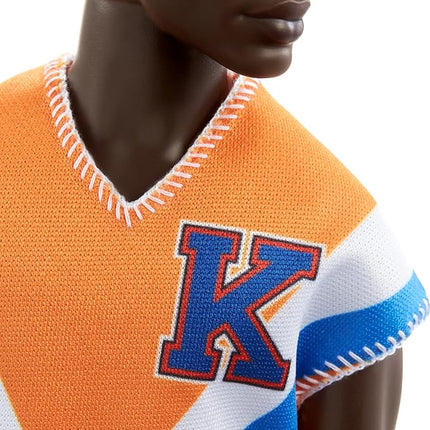 Barbie Fashionistas Ken Fashion Doll with Twisted Black Hair Wearing Orange Athletic Jersey, Shorts & White Sneakers